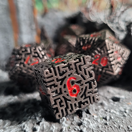 Mad Maze Gunmetal with Red Numbers Hollow Metal Dice Set of 7